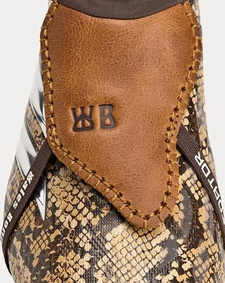 Close-up of the tan leather fold-over tongue on the Wales Bonner Predator Elite, hand-stitched with an embossed “WB” stamp