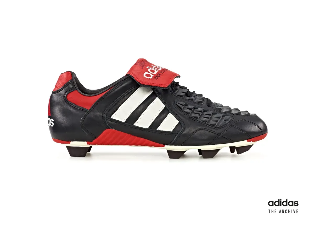 adidas Predator Touch from 1996 with red fold-over tongue and rubber ridges across the forefoot